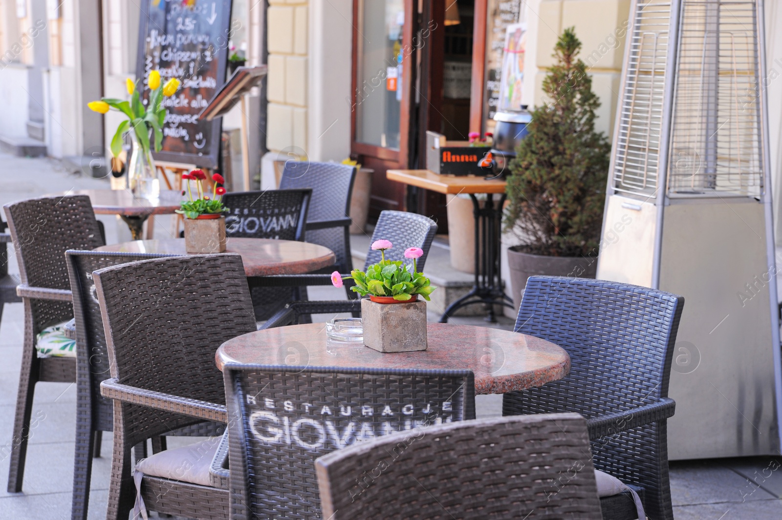 Photo of WARSAW, POLAND - MARCH 22, 2022: Beautiful view of modern cafe with outdoor terrace