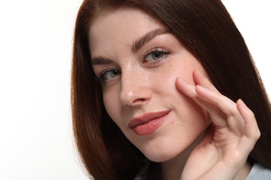 Portrait of beautiful woman with freckles on white background, closeup