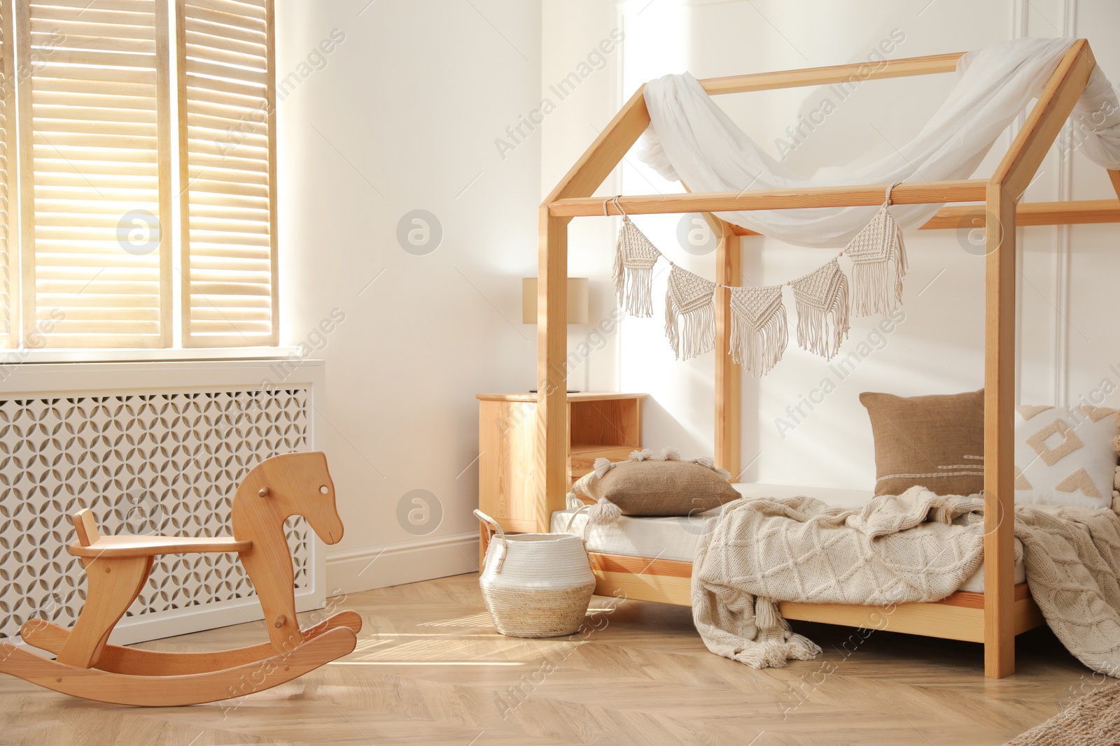 Photo of Stylish child room interior with house bed