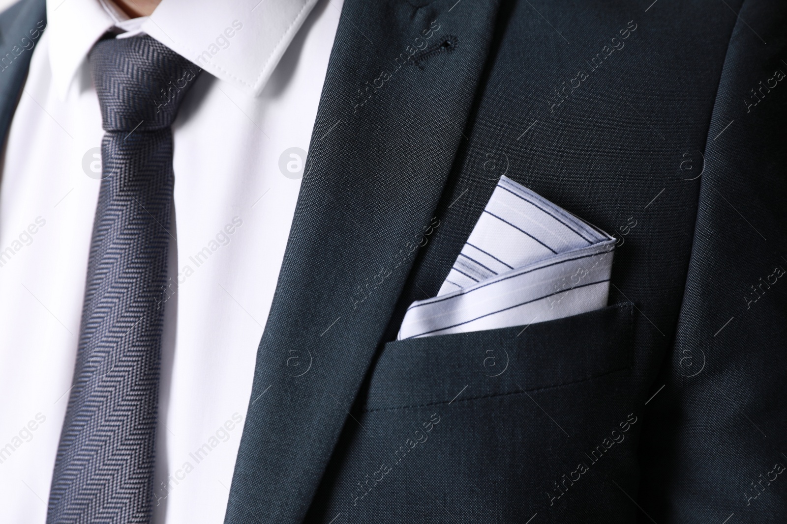 Photo of Man with handkerchief in suit pocket, closeup