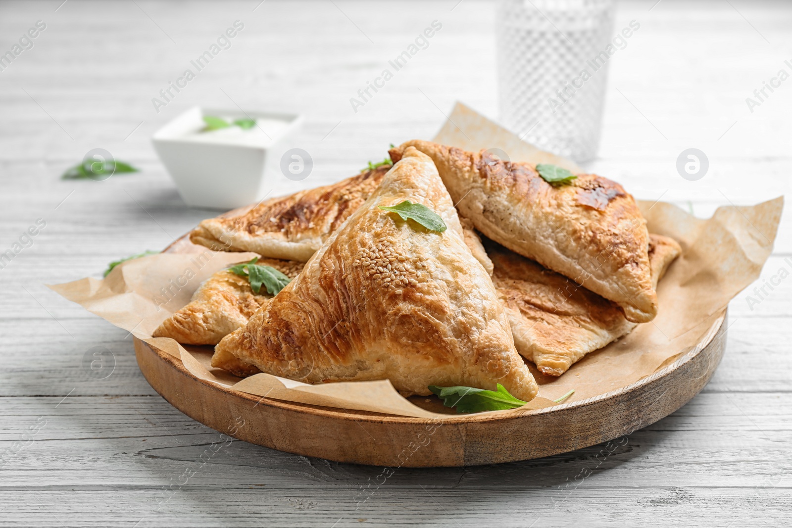 Photo of Fresh delicious puff pastry on white wooden table