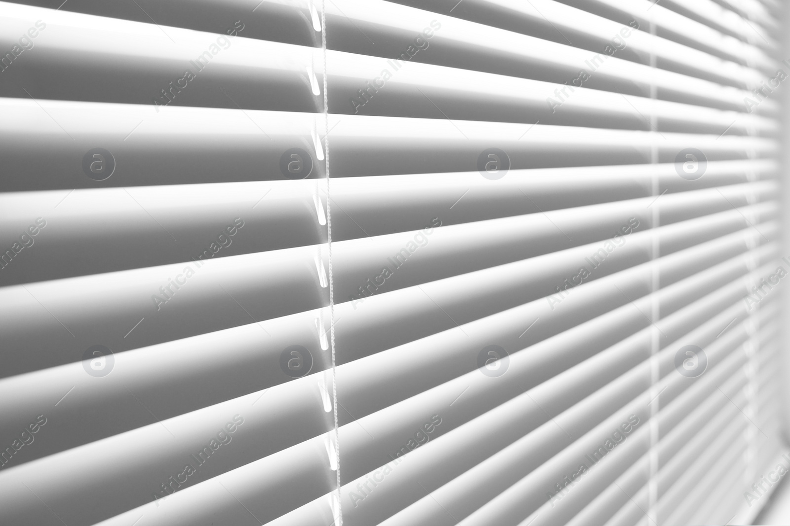 Photo of Closeup view of stylish horizontal window blinds