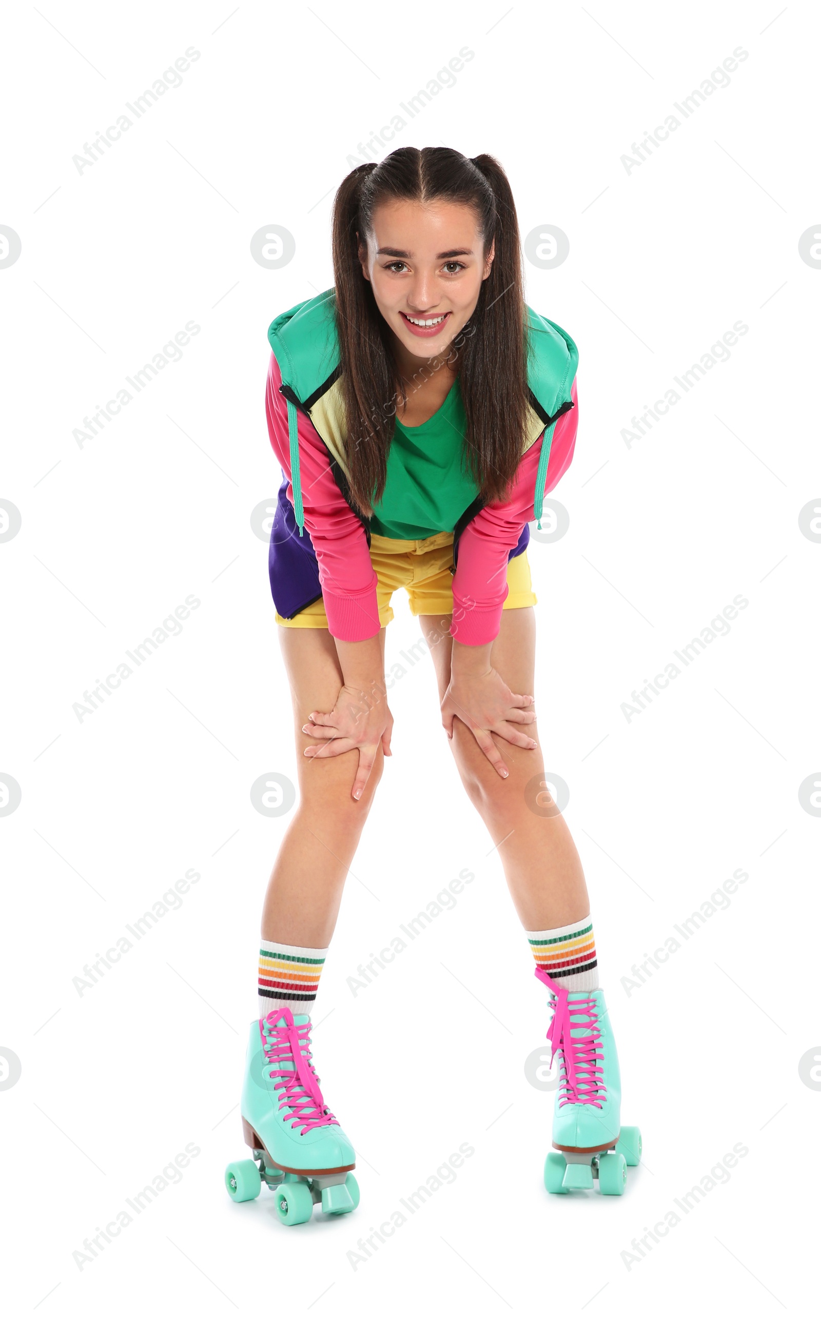 Photo of Young woman with roller skates on white background