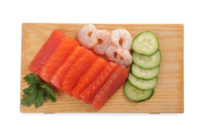 Photo of Delicious sashimi set of salmon and shrimps served with cucumbers and parsley isolated on white, top view
