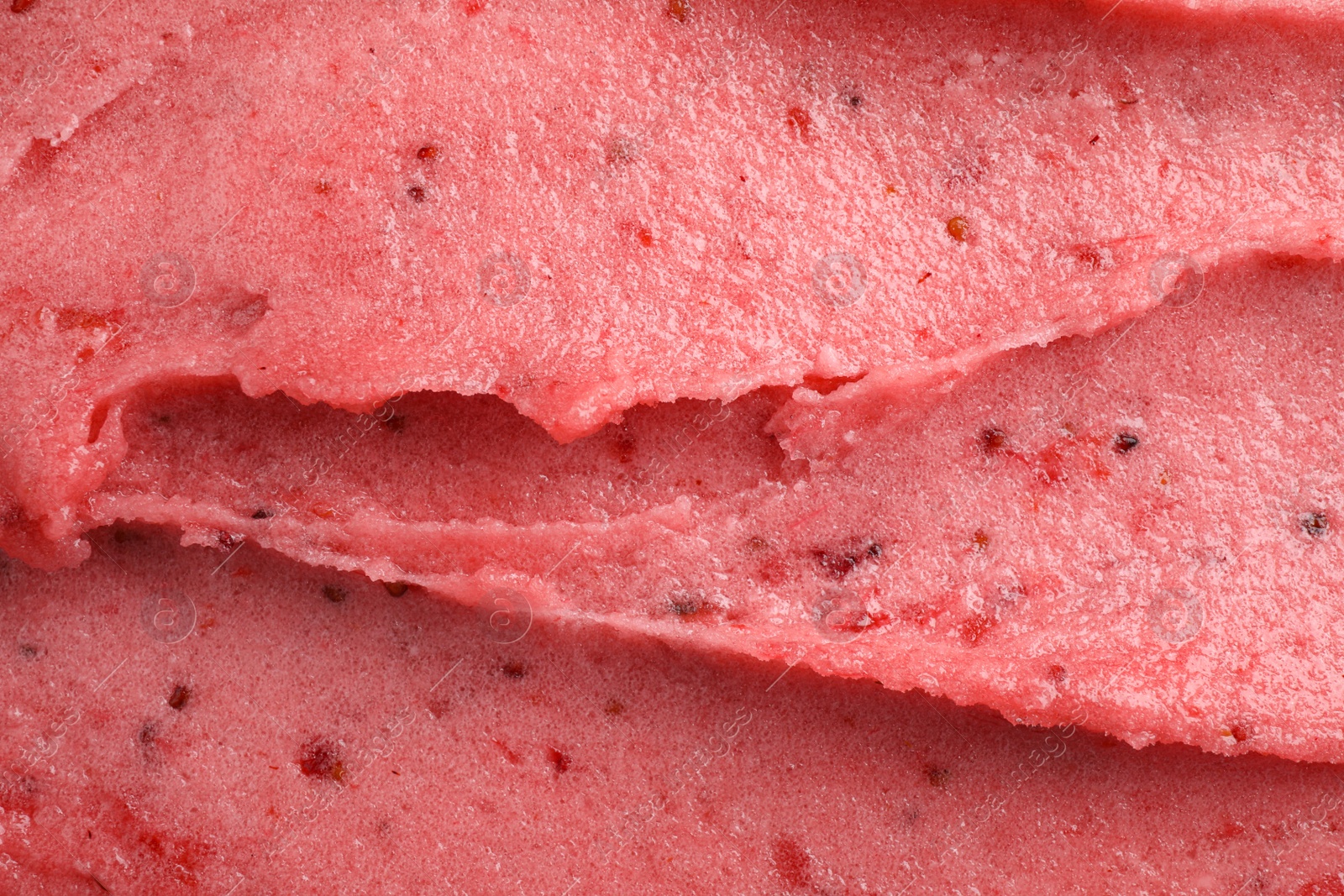 Photo of Delicious strawberry ice cream as background, closeup