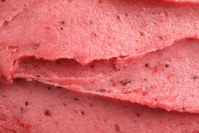 Photo of Delicious strawberry ice cream as background, closeup