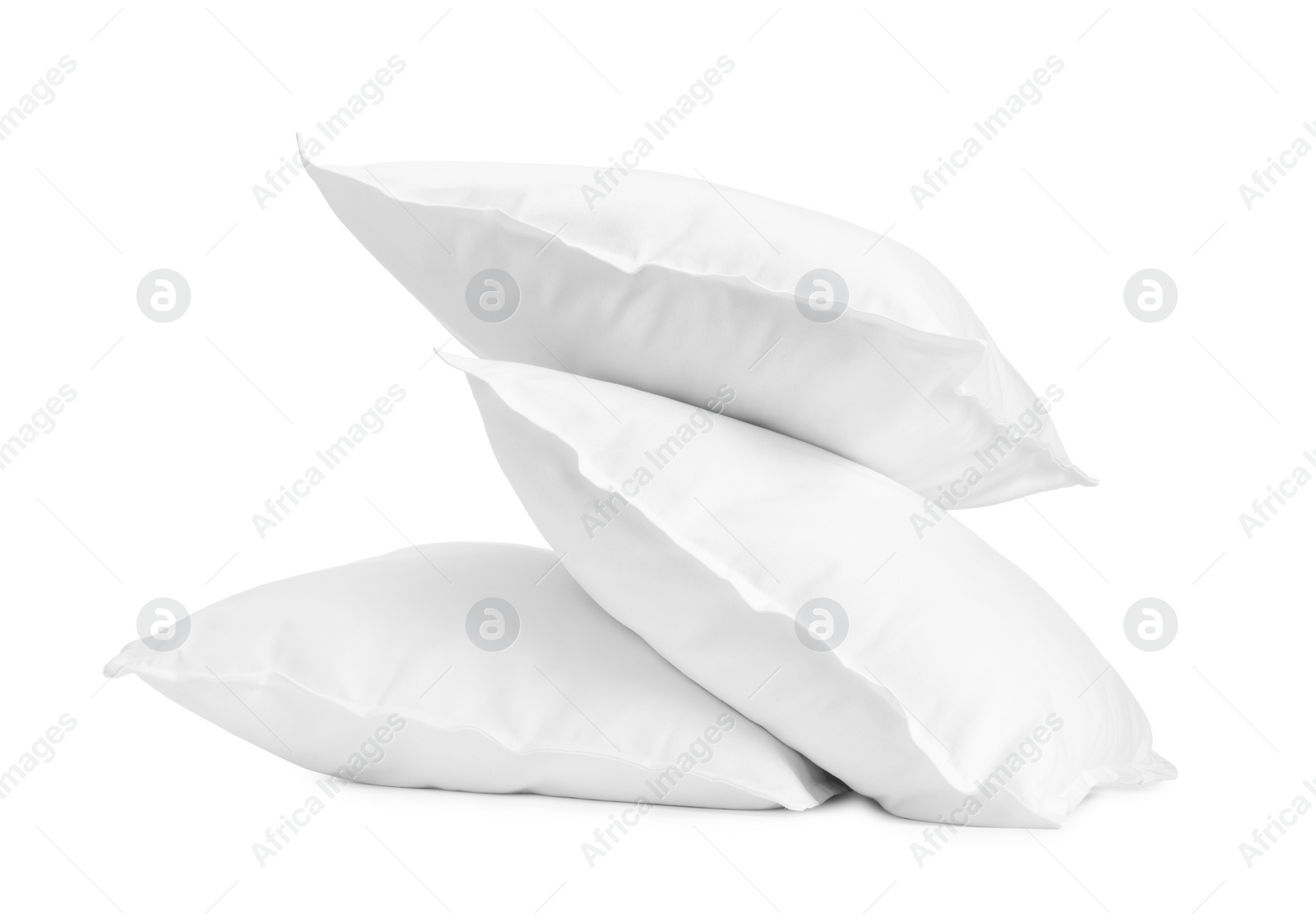 Photo of Three new soft pillows isolated on white