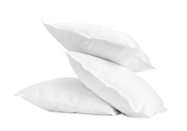 Photo of Three new soft pillows isolated on white