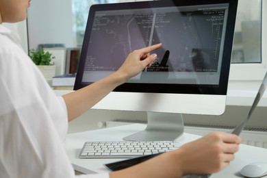 Photo of Doctor examining neck MRI image on computer in clinic, closeup