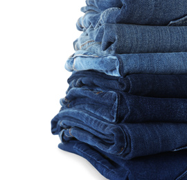 Stack of different jeans isolated on white