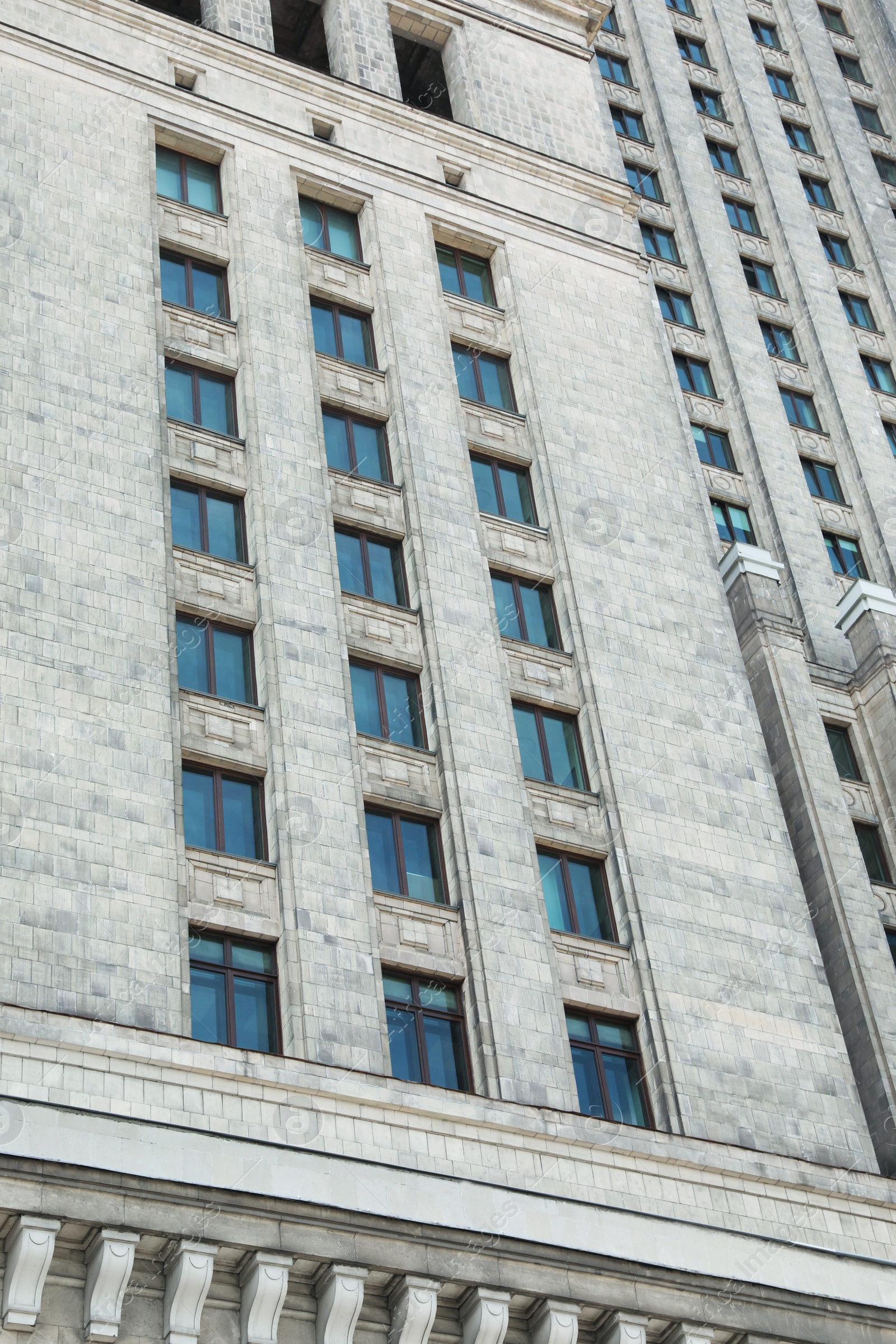 Photo of Low angle view of modern skyscraper outdoors