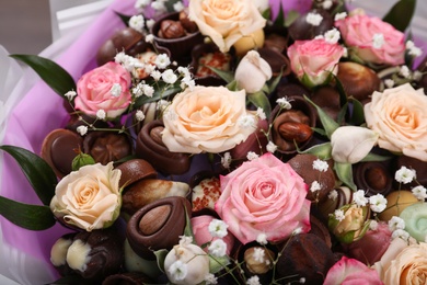 Beautiful food bouquet of sweets and flowers, closeup