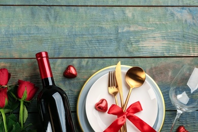 Photo of Beautiful table setting on wooden background, flat lay with space for text. Valentine's Day dinner