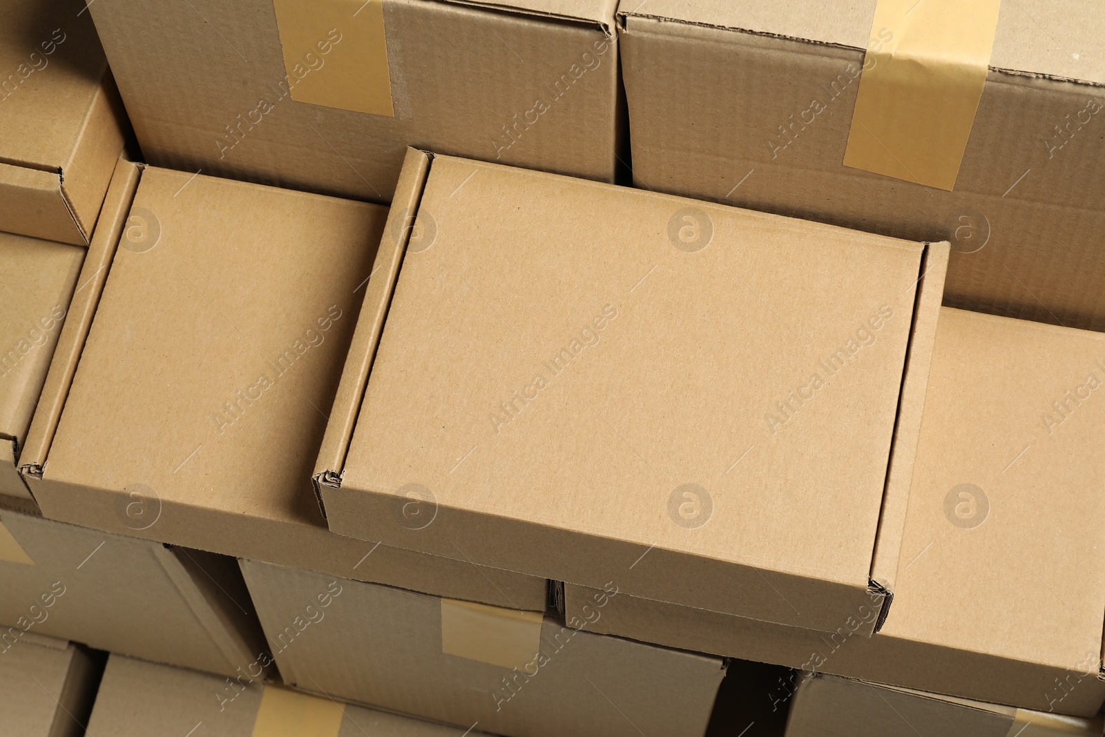 Photo of Many cardboard boxes as background, above view. Packaging goods