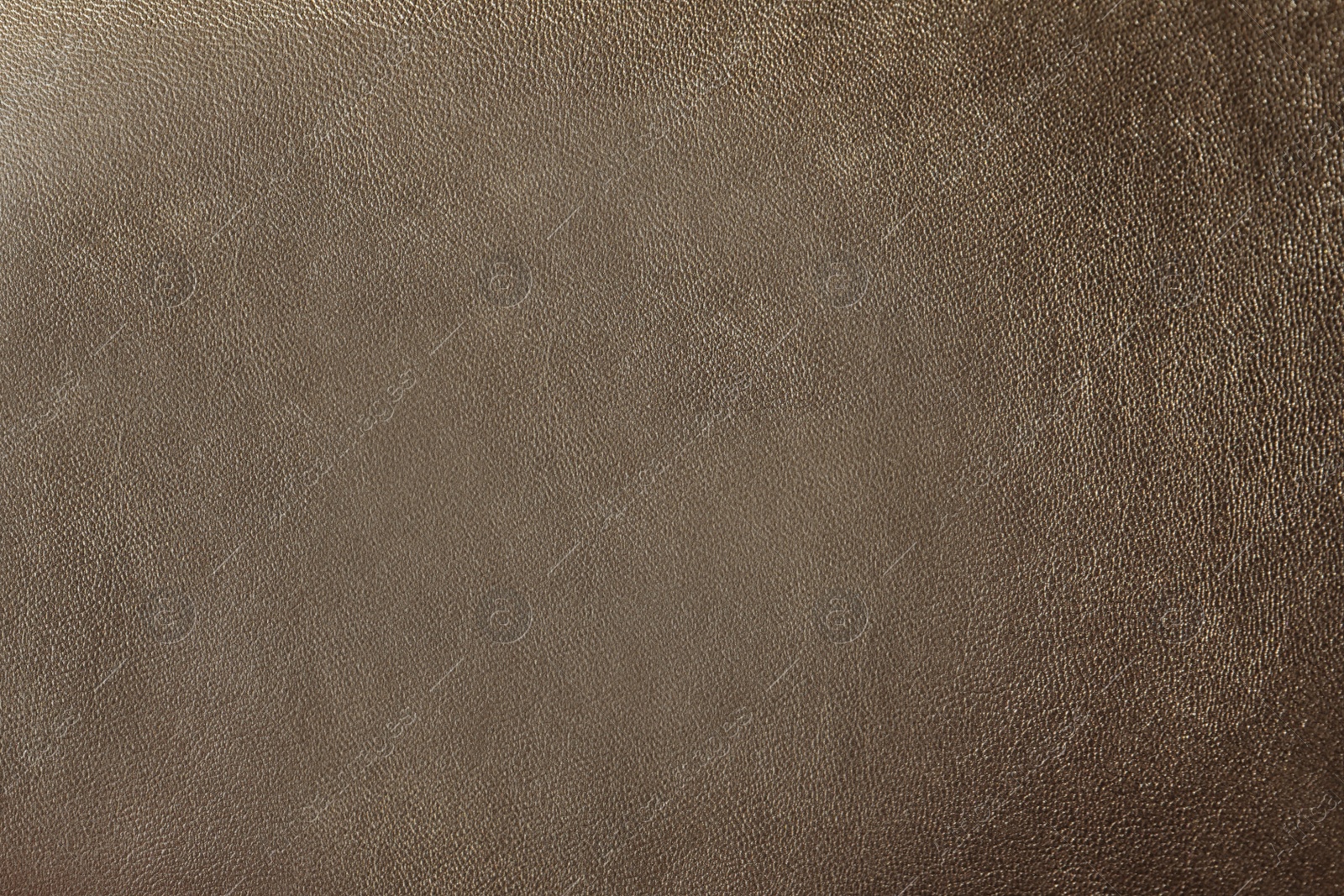 Photo of Texture of light brown leather as background, closeup