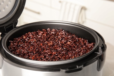 Photo of Delicious brown rice boiled in modern multi cooker