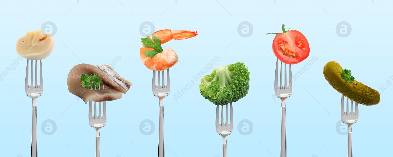 Image of Forks with different food products on light blue background, collection