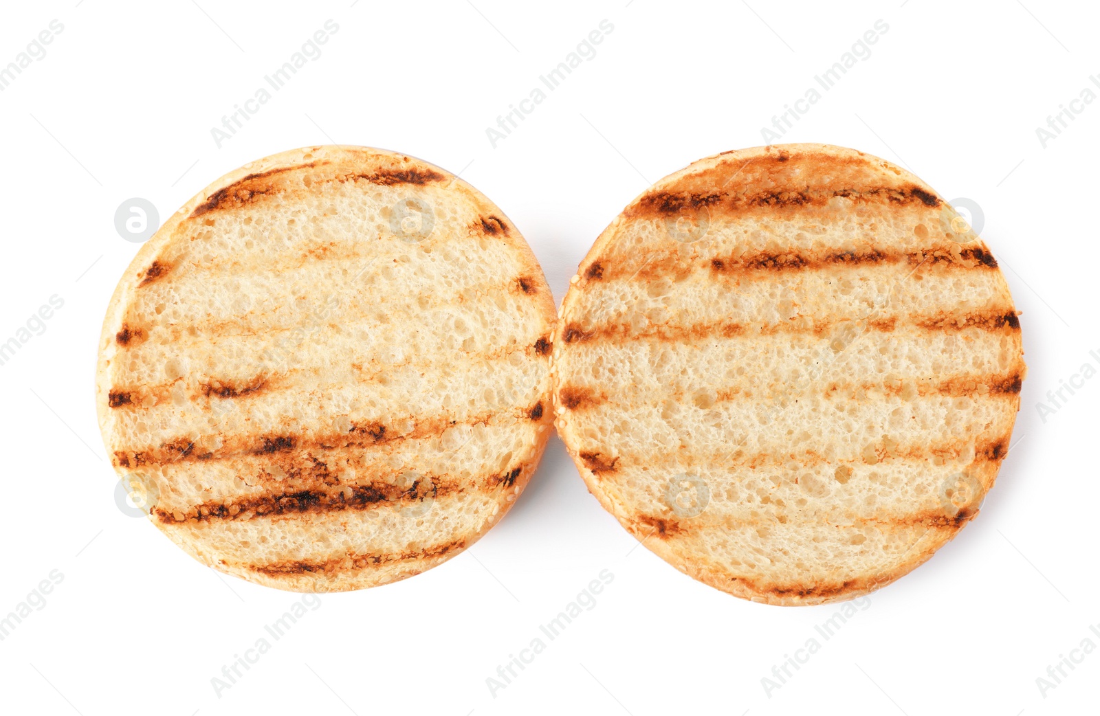 Photo of Halves of grilled burger bun isolated on white, top view