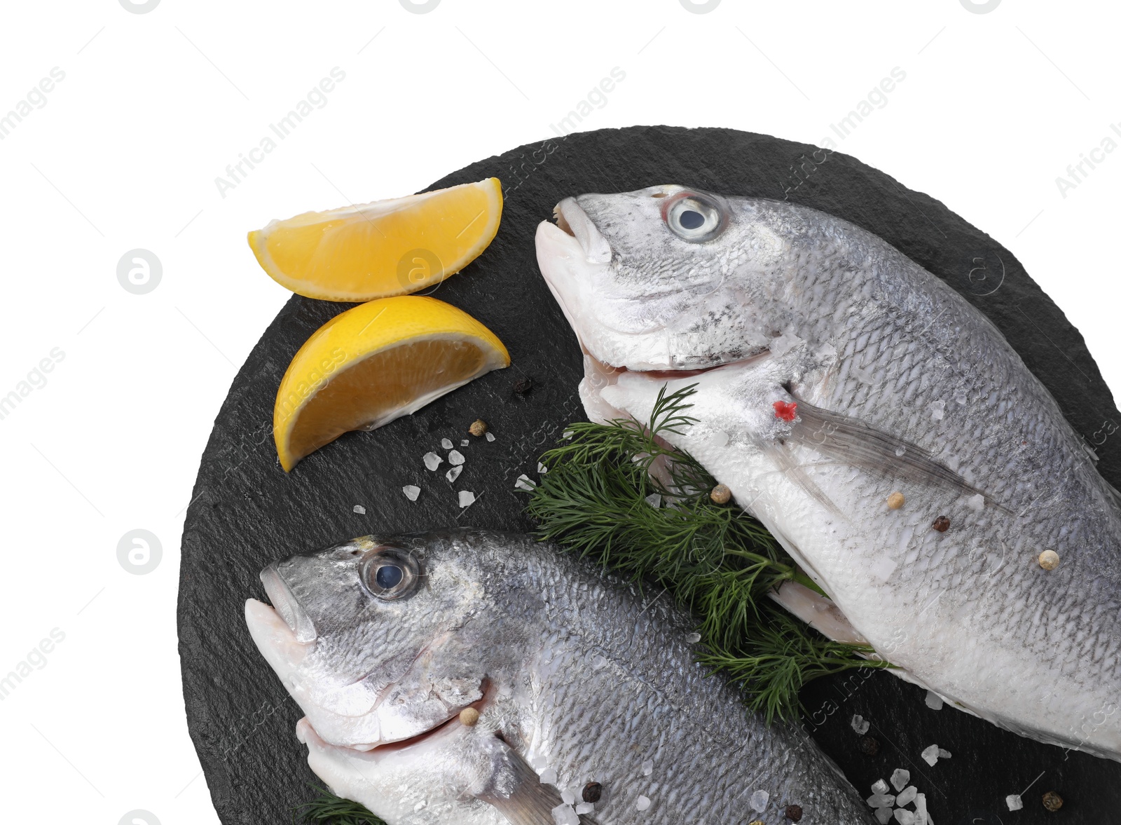 Photo of Raw dorado fish, dill, lemon wedges and peppercorns isolated on white, top view