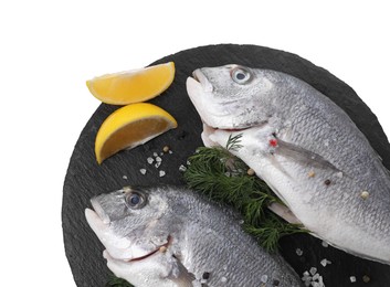 Raw dorado fish, dill, lemon wedges and peppercorns isolated on white, top view