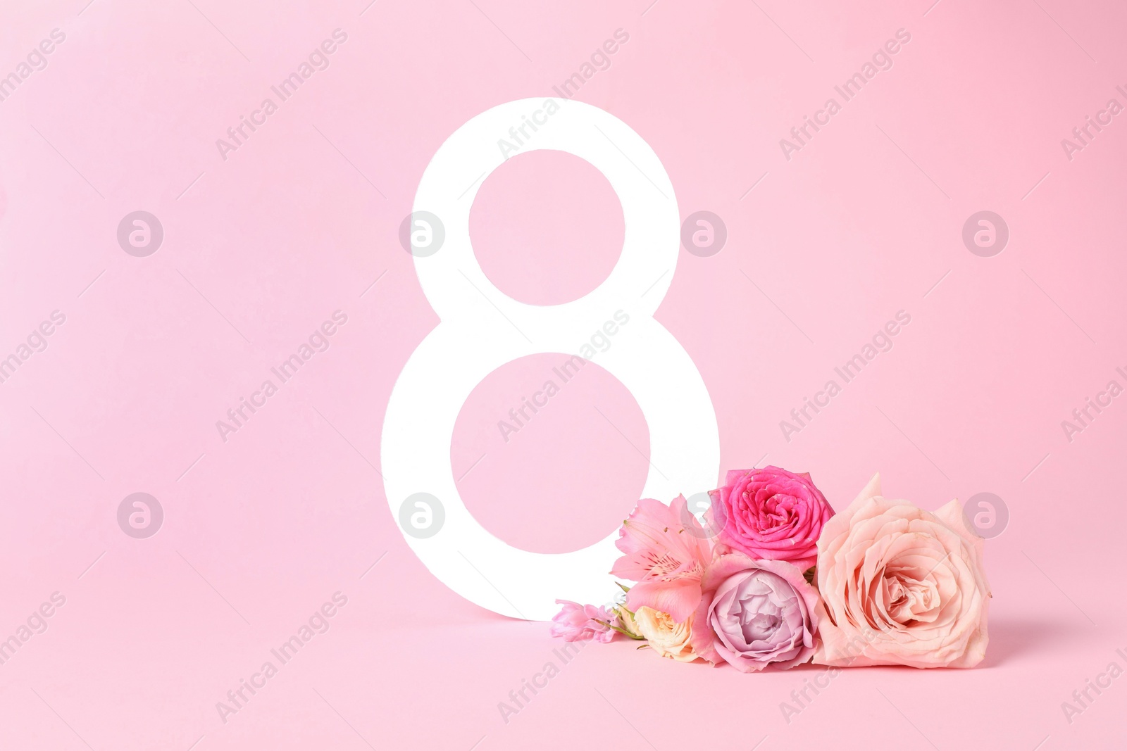 Photo of 8 March greeting card design with beautiful flowers on light pink background