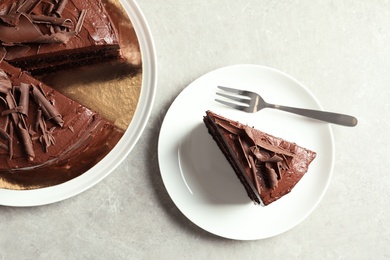 Photo of Flat lay composition with tasty chocolate cake on table