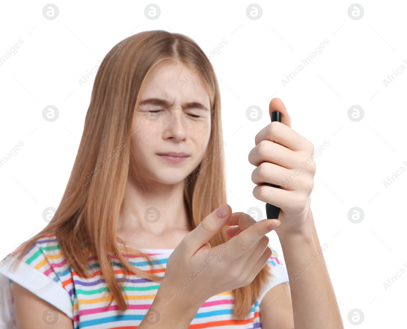 Photo of Teen girl using lancet pen on white background. Diabetes control