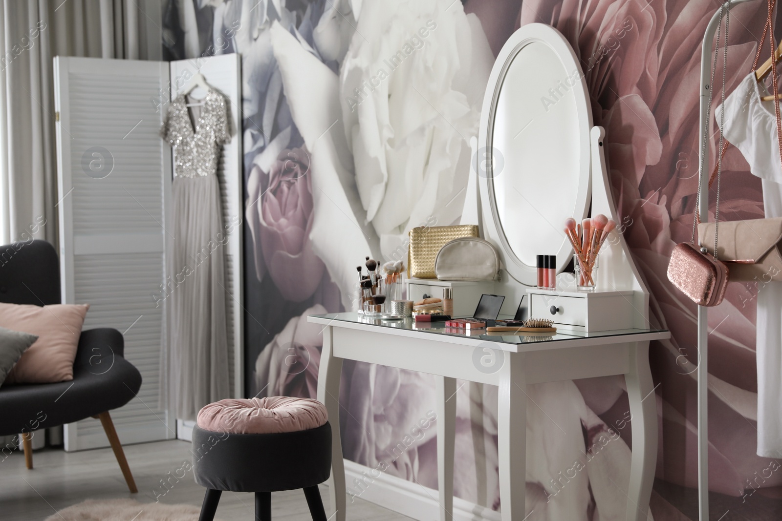 Photo of Stylish room interior with elegant dressing table and floral wallpaper