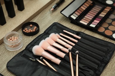 Photo of Professional makeup artists workplace with tools and cosmetic, closeup