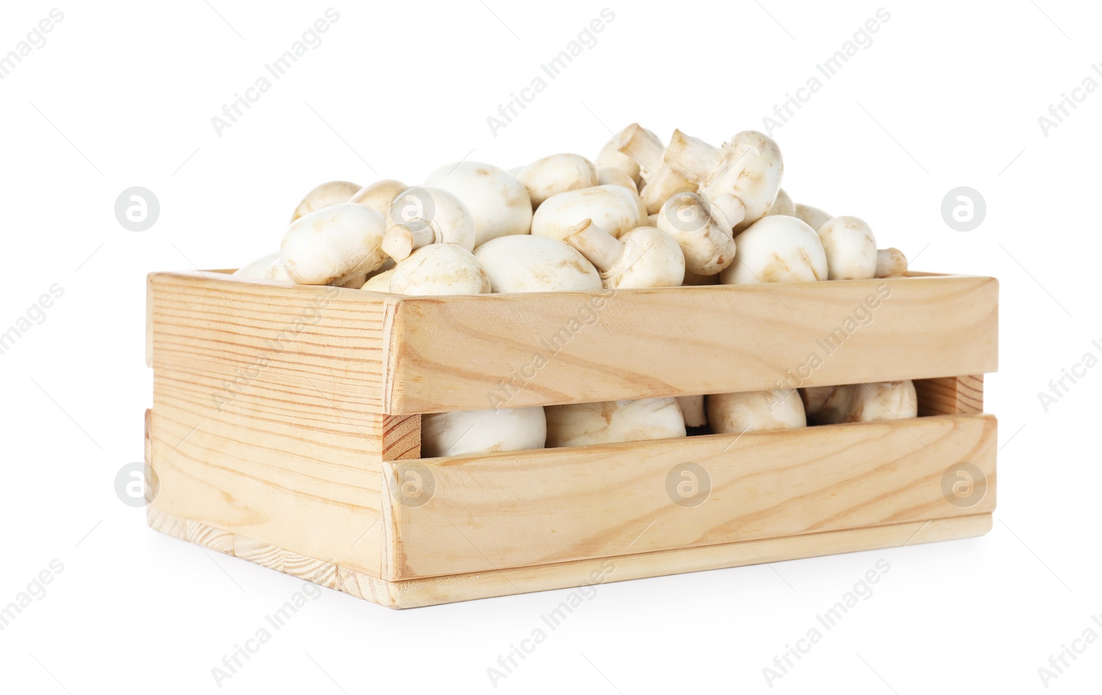 Photo of Wooden crate full of fresh raw mushrooms on white background