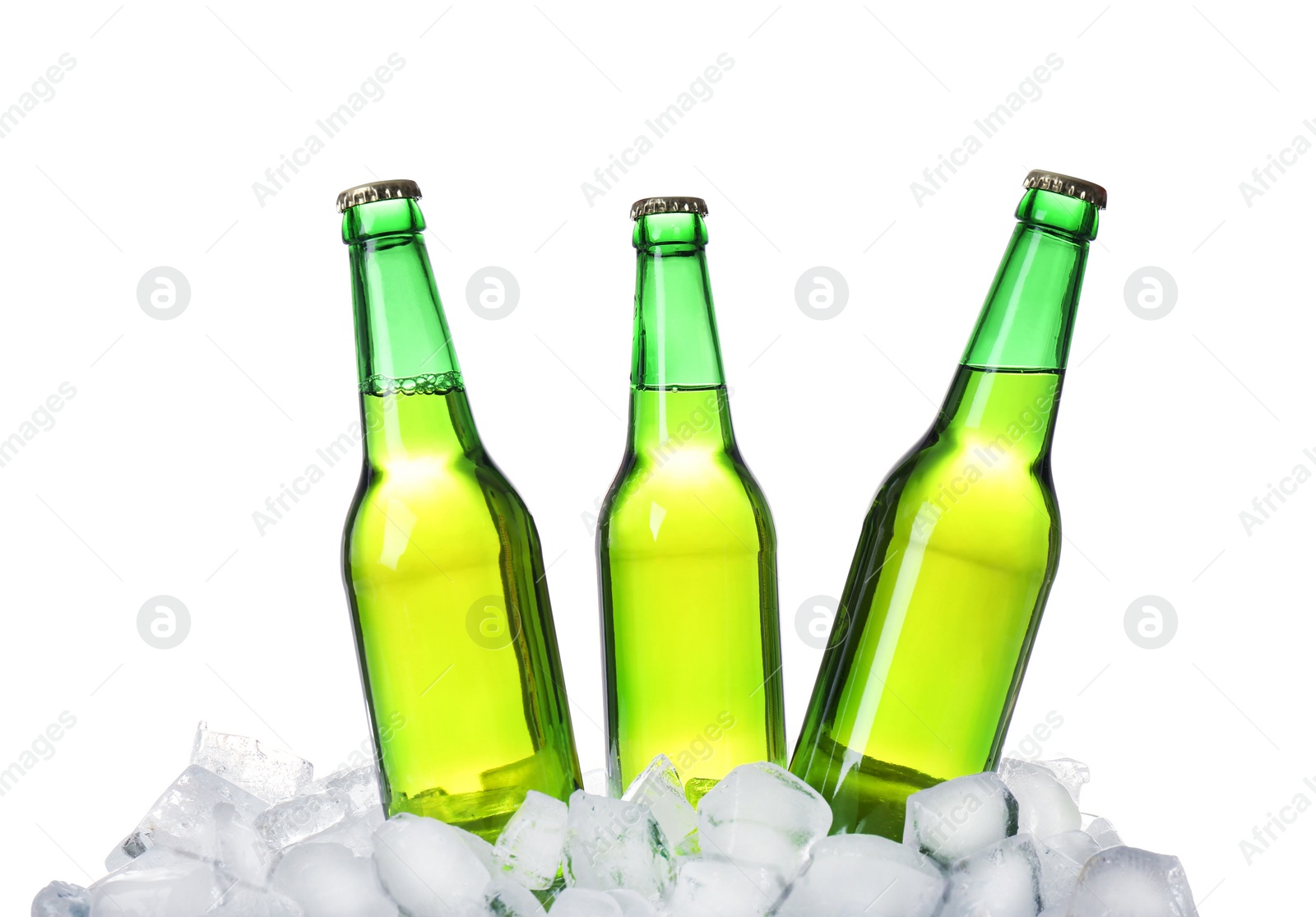 Photo of Bottles of beer on ice cubes against white background