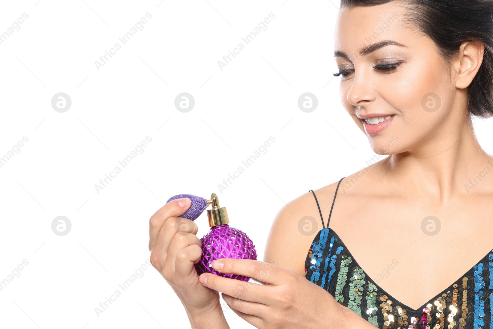 Photo of Young woman with bottle of perfume on white background