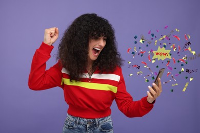 Discount offer. Excited young woman holding smartphone on purple background. Confetti, streamers and word Wow flying from device