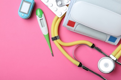 Photo of Flat lay composition with different medical objects and space for text on color background