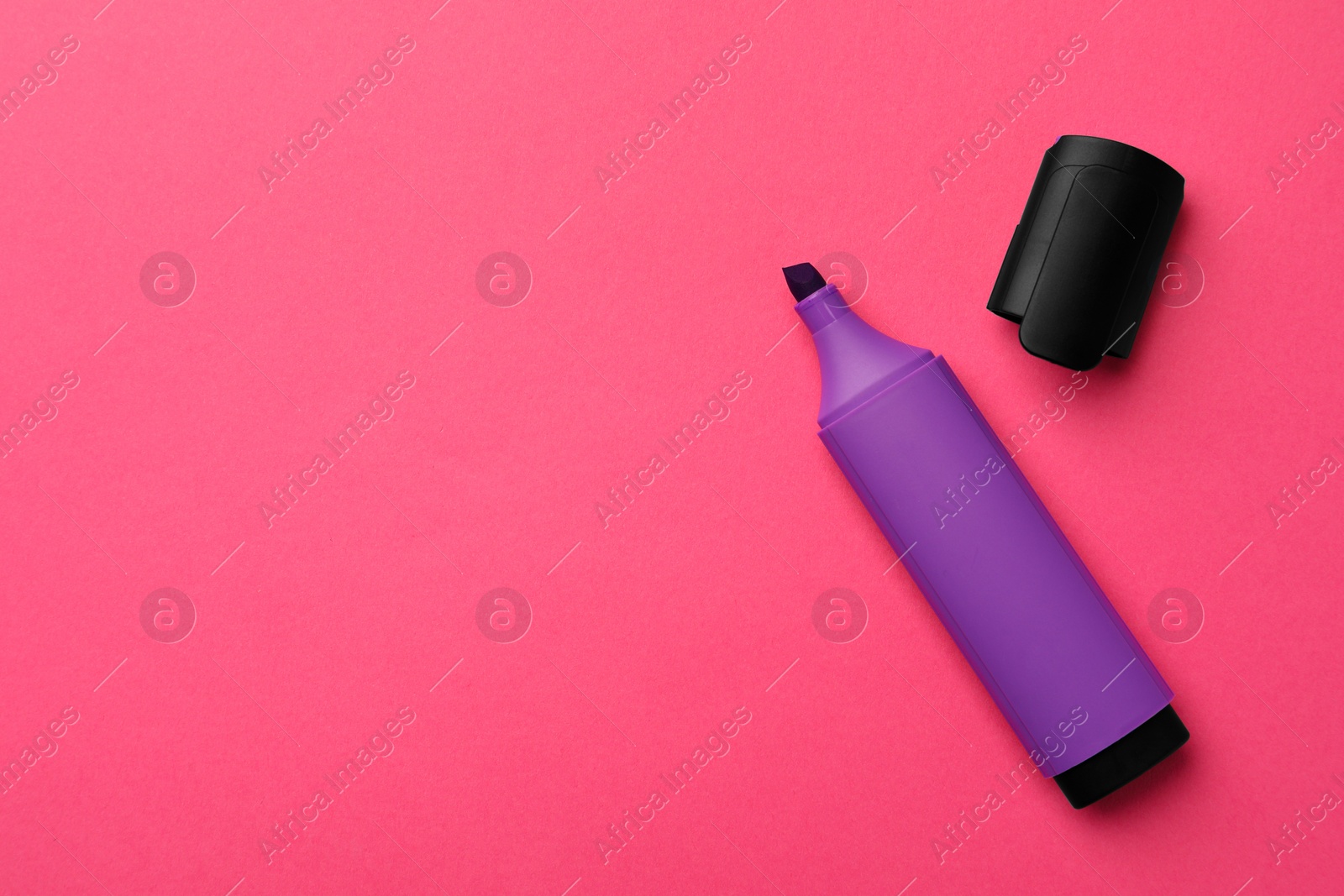 Photo of Bright purple marker on pink background, flat lay. Space for text