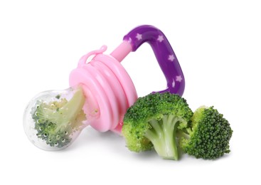 Nibbler with boiled broccoli on white background. Baby feeder