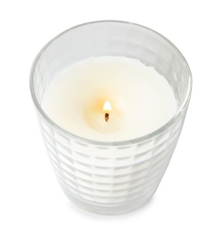 Burning candle in glass holder on white background