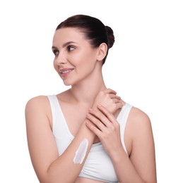 Beautiful woman with smear of body cream on her arm against white background