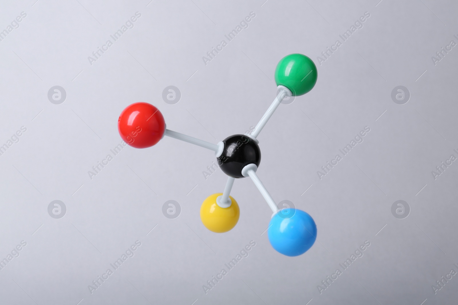 Photo of Molecular atom model on light grey background. Chemical structure