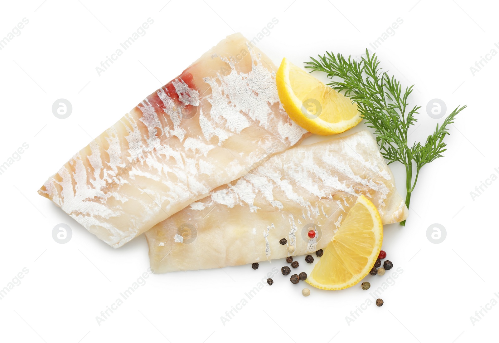 Photo of Fresh raw cod fillets with peppercorns, dill and lemon isolated on white, top view