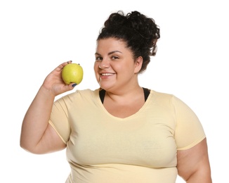 Happy overweight woman with apple on white background