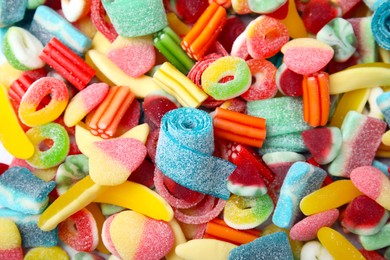 Photo of Tasty colorful jelly candies as background, above view