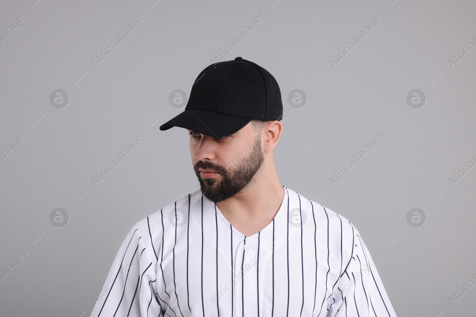 Photo of Man in stylish black baseball cap on light grey background