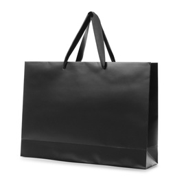 Photo of Paper shopping bag with handles on white background. Mockup for design