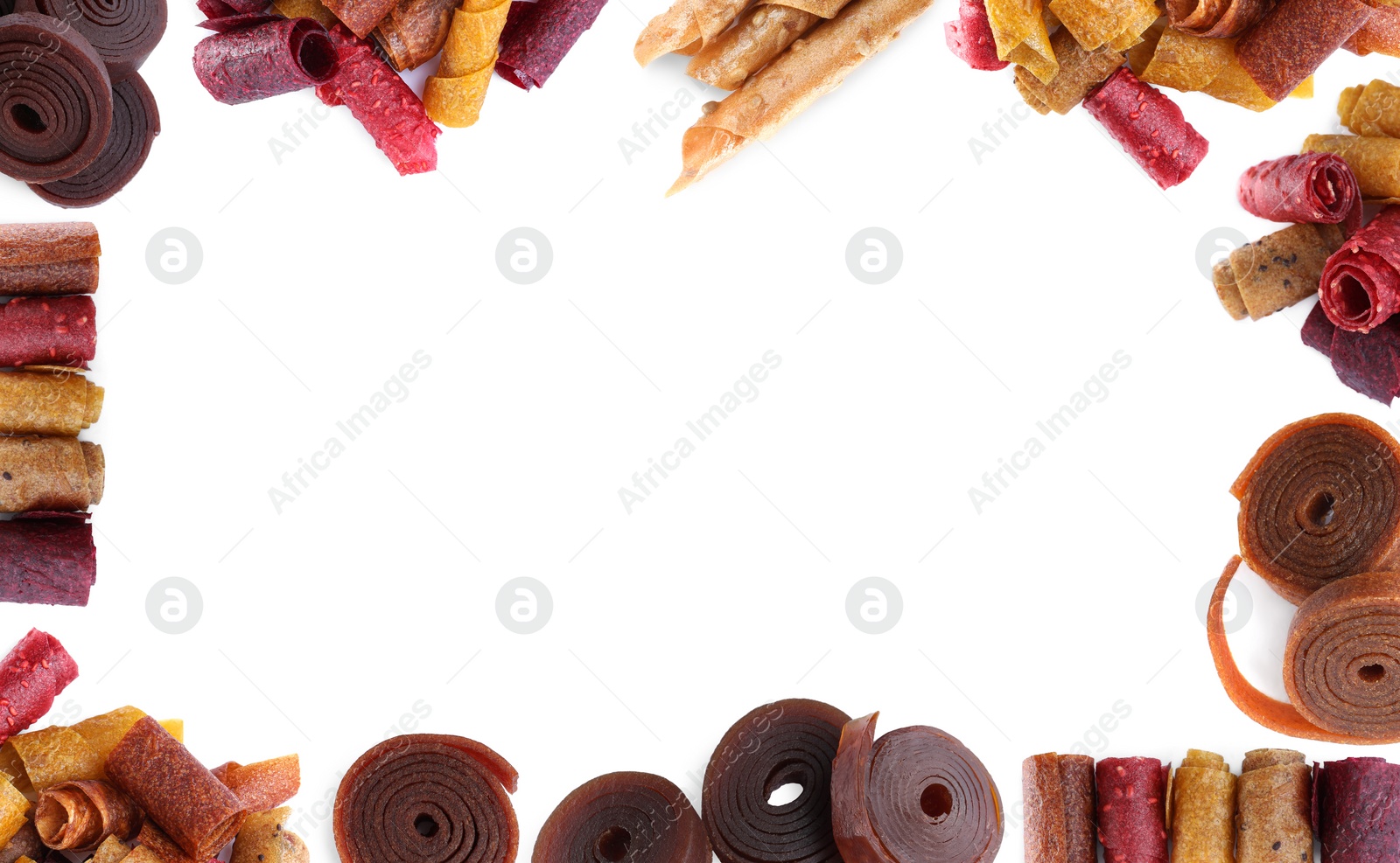 Image of Frame made of delicious fruit leather rolls on white background