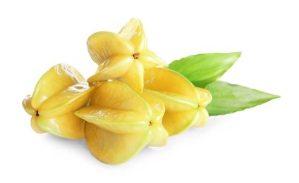 Ripe carambolas with green leaves on white background