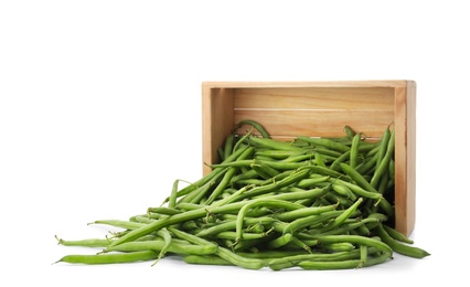 Photo of Fresh green beans and wooden crate on white background