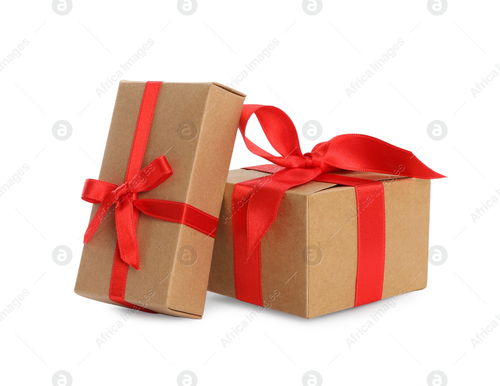 Photo of Christmas gift boxes decorated with red bows on white background