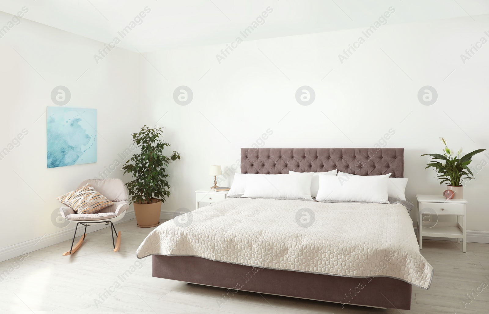 Photo of Elegant interior of contemporary bedroom with plants