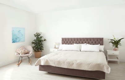 Elegant interior of contemporary bedroom with plants